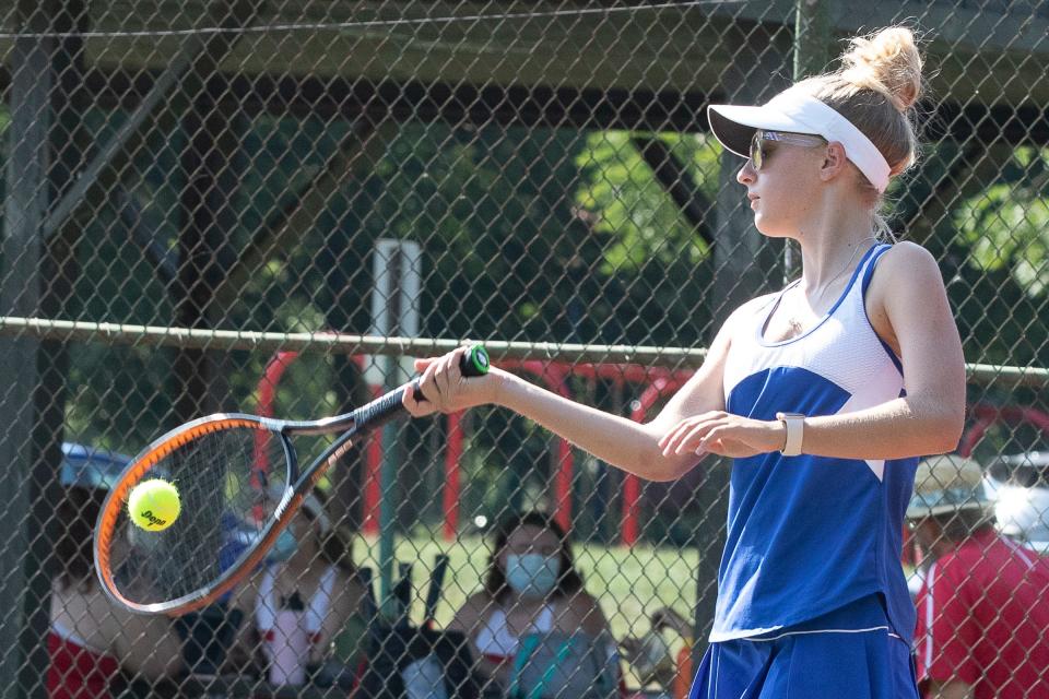 Abbey Sims-Clark, a senior with the Chillicothe Cavaliers girls tennis team, strikes the ball in a match against Jackson on Aug. 24, 2021. She was the league's player of the year for the third straight year.