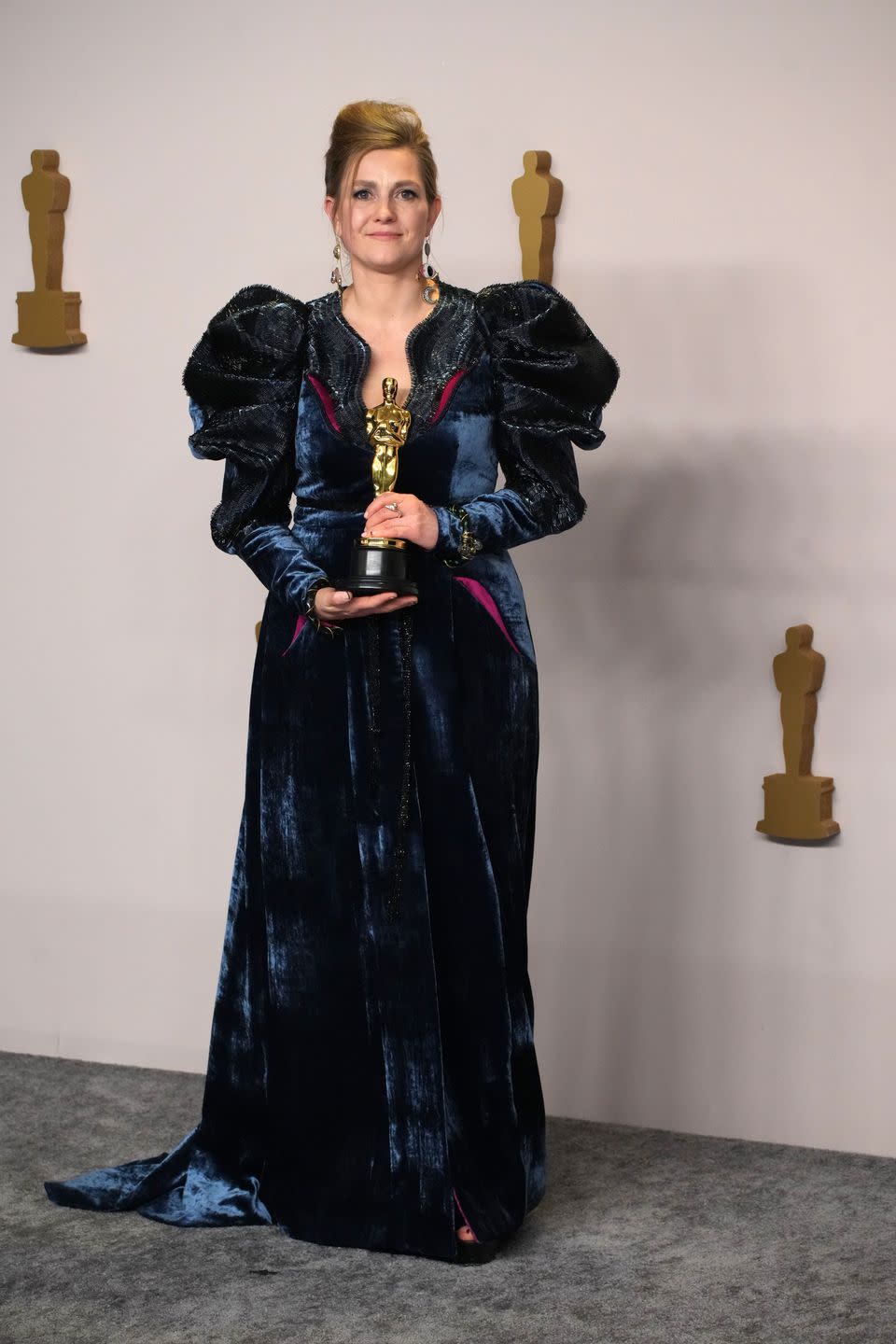 holly waddington, winner of the best costume design award for poor things poses in the press room during the 96th annual academy awards at ovation hollywood on march 10, 2024 in hollywood, california