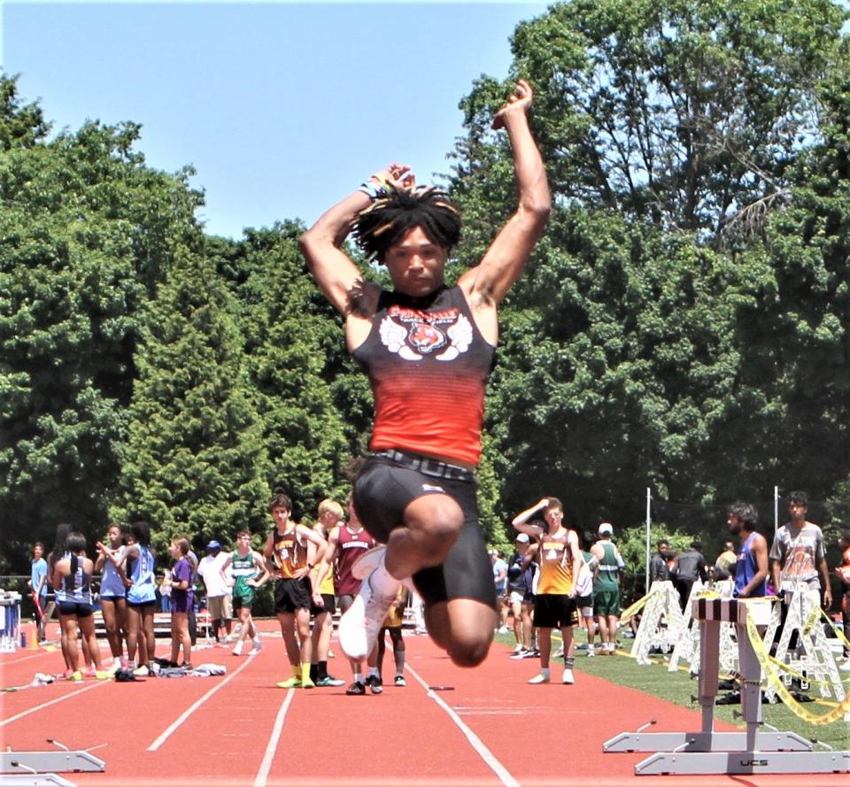 Spring Valley's Kevin Dessalines is in flight during the boys pentathlon long jump. He won bronze in the pent at the May 27, 2023 Section 1 Class A track and field championships.