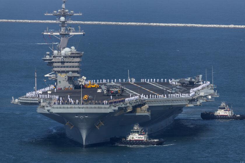 San Pedro, CA - May 21: Approximately 3,000 sailors manning the rails, a method of saluting (or rendering honors) aboard the USS Carl Vinson arrives at LA Harbor for LA Fleet Week in San Pedro Tuesday, May 21, 2024. It has been 13 years since LA hosted an aircraft carrier, which was the USS Abraham Lincoln. LA Fleet Week is an annual, multi-day celebration of American Sea Services held on the LA Waterfront at the Port of Los Angeles over the extended Memorial Day Weekend. Events include: active duty ship tours, military displays and equipment demonstrations, live entertainment, neighborhood activations, downtown San Pedro and Wilmington Welcome Parties, aircraft flyovers, Galley Wars culinary cook-off competition between Navy, Marine Corps, Coast Guard, Air Force and Army teams, competitions including dodgeball and Military Has Talent, military band performances across L.A. (Allen J. Schaben / Los Angeles Times)