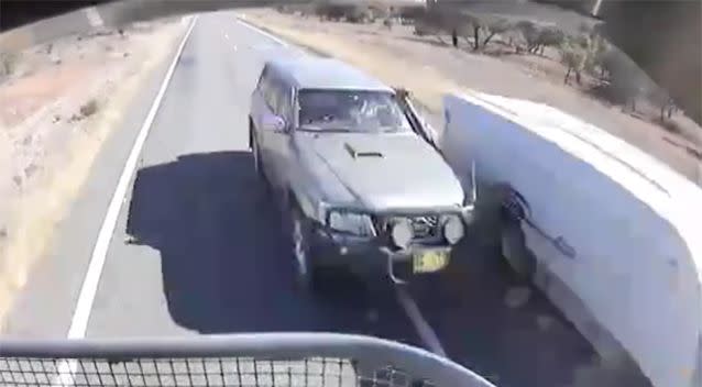 The overtaking vehicle came within just inches of the other four-wheel drive and the b-double, narrowly avoiding collision. Photo: Facebook / Dash Cam Owners Australia