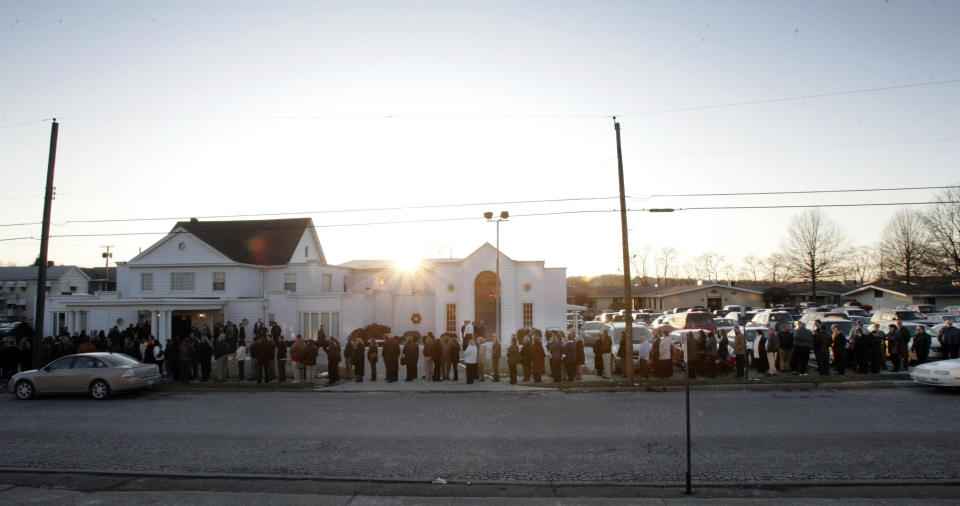 FILE - In this Feb. 24, 2009, file photo, the sun goes down behind the funeral home as mourners line up for the funeral of Kenzie Houk in New Castle, Pa. Jordan Brown, who was eleven-years-old at the time, was charged in the shooting death of the 26-year-old pregnant mother of two. On Wednesday, July 1, 2020, Brown and his attorneys filed a wrongful prosecution and conviction lawsuit, alleging that state police investigators manipulated interviews, evidence and procedures to push the narrative that Brown had killed his soon-to-be stepmom. (AP Photo/Keith Srakocic, File)