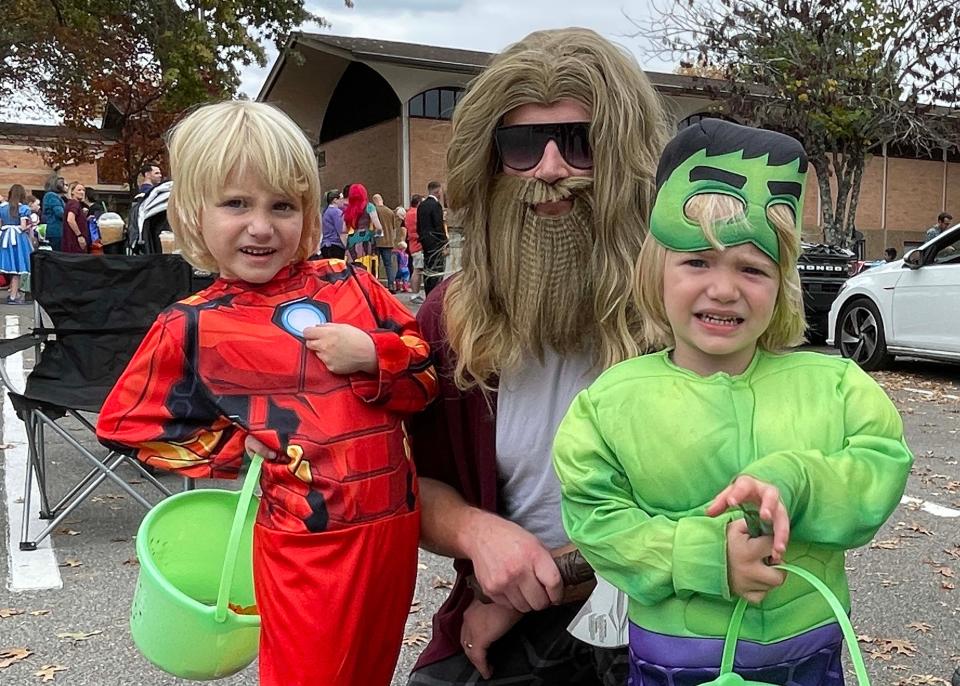 Theo Taylor dressed as Iron Man with dad Nick Taylor as Thor and Beck Taylor as Hulk.