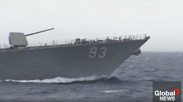 PHOTO: A Chinese warship appears to have intercepted the pair of U.S. and Canadian ships transiting through the Taiwan Strait overnight. (Global News)