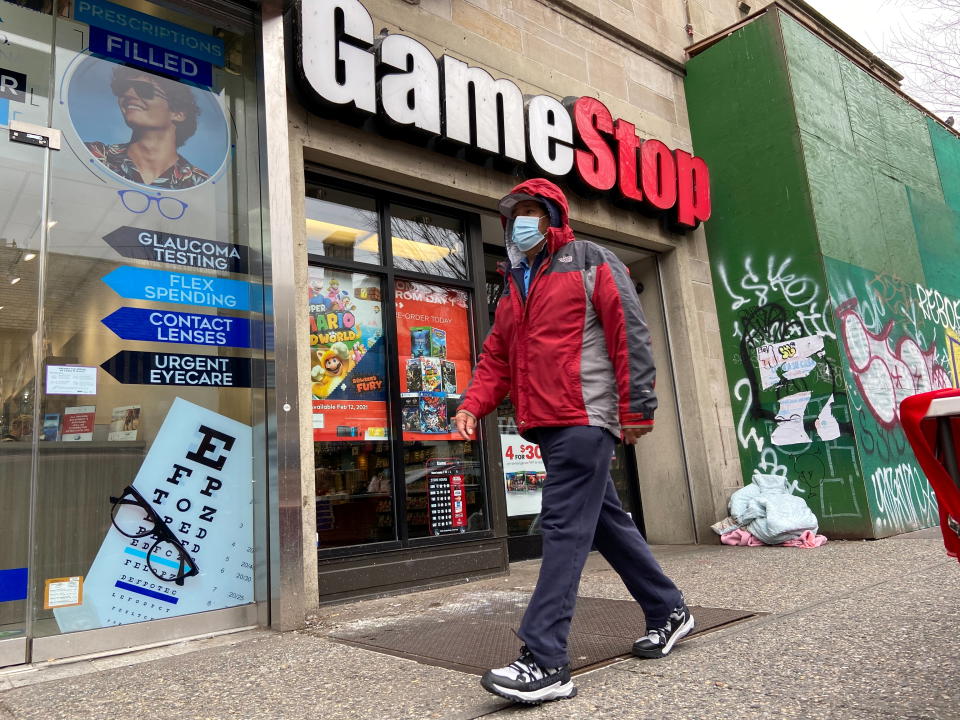 A man walks in front of a GameStop store in the Jackson Heights neighborhood of New York City, New York, U.S. January 27, 2021. Picture taken January 27, 2021. REUTERS/Nick Zieminski