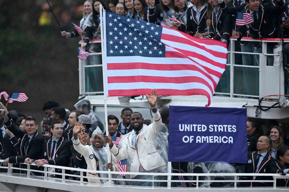 <p>Sina Schuldt/picture alliance via Getty</p> Coco Gauff, LeBron James and Team USA at the Olympics opening ceremony