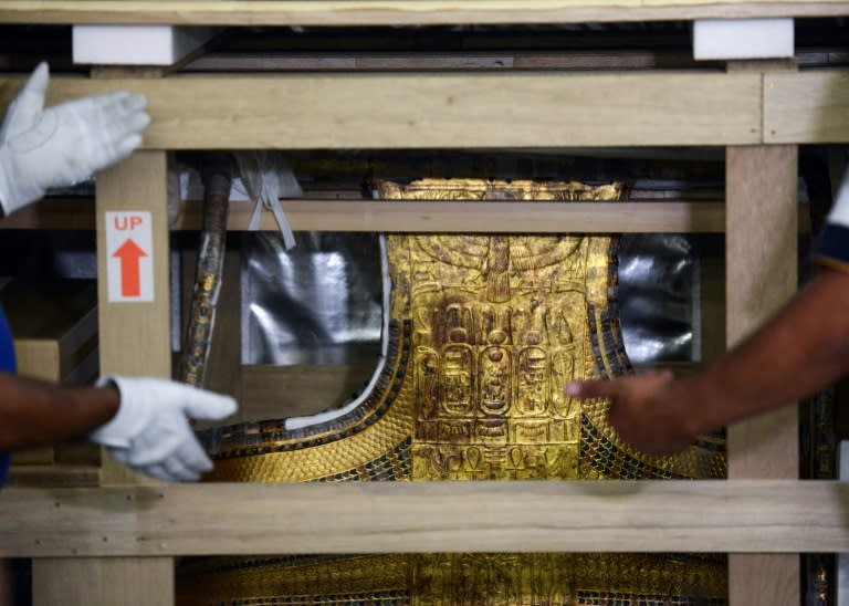 The chariot of the ancient Egyptian boy-king Tutankhamun is revealed after being delivered to its new home, the Grand Egyptian Museum, on May 23, 2017