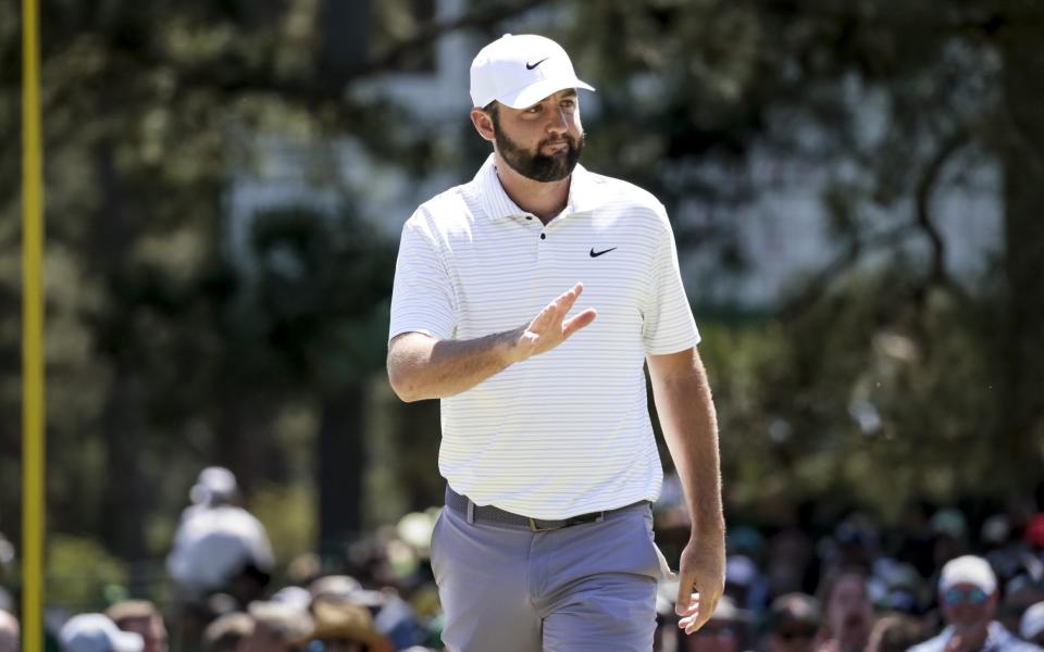 Scottie Scheffler reacts after landing a birdie on the first hole