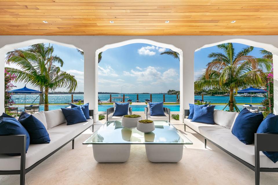 The south loggia captures wide views of the Intracoastal Waterway at a renovated-and-expanded mansion at 10 Tarpon Island in Palm Beach.
