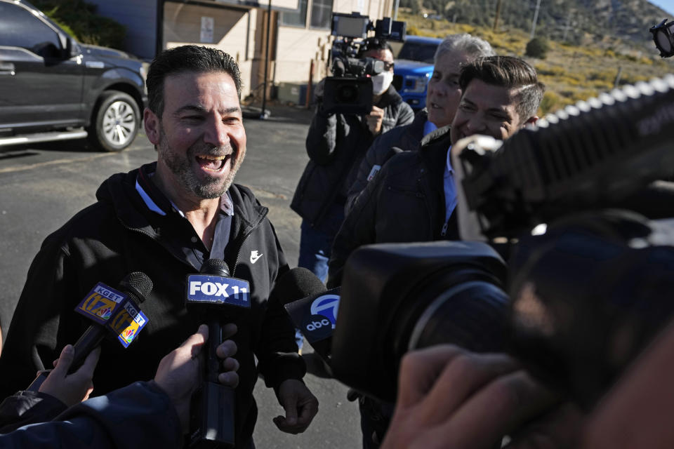 Store co-owner Nidal Khalil talks with the media at the Midway Market & Liquor store, Thursday, Oct. 12, 2023, in Frazier Park, Calif., where a winning Powerball lottery ticket was sold. A player in California won a $1.765 billion Powerball jackpot Wednesday night, ending a long stretch without a winner of the top prize. (AP Photo/Marcio Jose Sanchez)