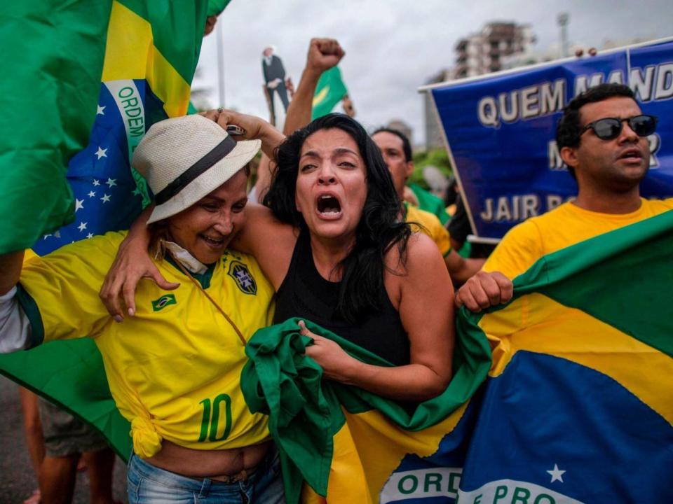 Bolsonaro supporters cheer his first-round victory (AFP/Getty)