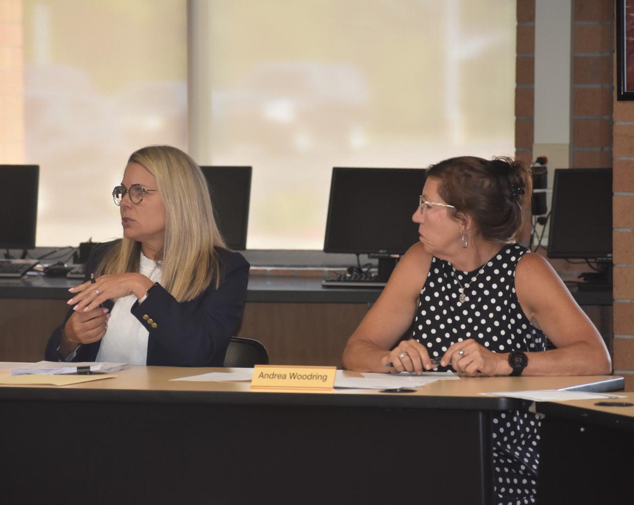 Addison Community Schools new interim Superintendent Julie Helber, left, talks during the board of education's special meeting on July 31 for interviewing and selecting the board's newest appointed trustee. Also pictured is Addison school board President Andrea Woodring.