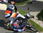 LONDON, ENGLAND - AUGUST 09: Maik Baier of Germany crashes into Tory Nyhaug of Canada during the Men's BMX Cycling Quarter Finals on Day 13 of the London 2012 Olympic Games at BMX Track on August 9, 2012 in London, England. (Photo by Phil Walter/Getty Images)