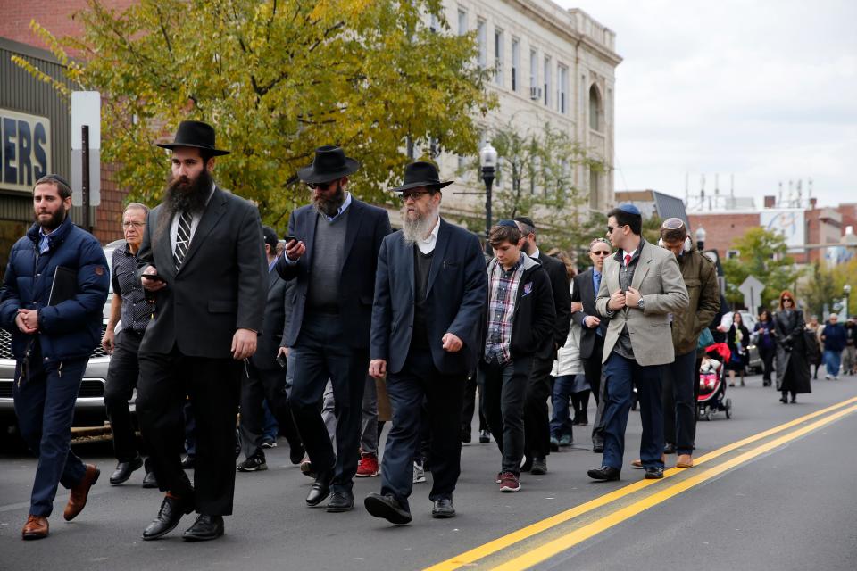 A proces­sional walks along Forbes Avenue after the funeral of Dr. Jerry Rabinowitz, 66, in the Squirrel Hill neighborhood of Pittsburgh Tuesday, October 30, 2018. Rabinowitz with 10 others was shot and killed Saturday during a service at Tree of Life Congregation Synagogue in Pittsburgh.  

Robert Bowers allegedly screamed anti-Semitic epithets, as he opened fire on the congregants, law enforcement officials said. Eleven worshippers were killed and six other people were wounded Saturday.