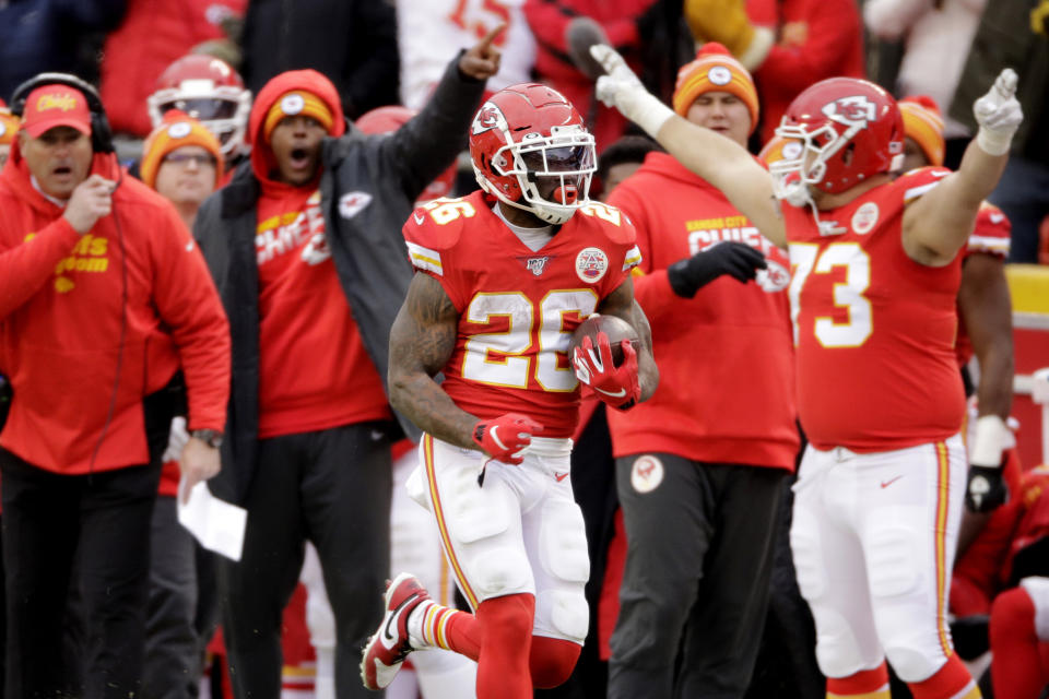 Kansas City Chiefs running back Damien Williams (26) runs for a touchdown during the second half of an NFL football game against the Los Angeles Chargers in Kansas City, Mo., Sunday, Dec. 29, 2019. (AP Photo/Charlie Riedel)