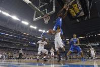 Apr 7, 2014; Arlington, TX, USA; Kentucky Wildcats forward Alex Poythress (22) flips over Connecticut Huskies guard/forward Lasan Kromah (20) in the second half during the championship game of the Final Four in the 2014 NCAA Mens Division I Championship tournament at AT&T Stadium. Bob Donnan-USA TODAY Sports