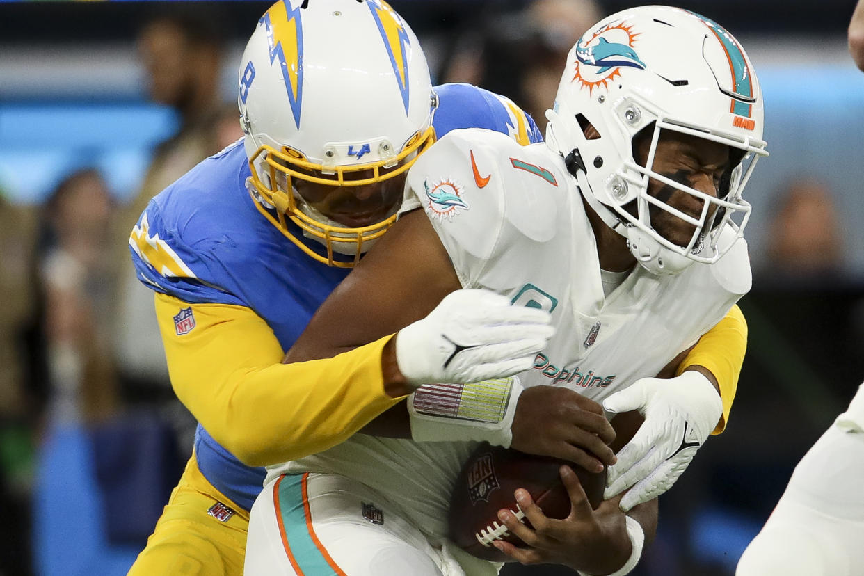 Tua Tagovailoa (1) and the Dolphins' offense struggled quite against the Chargers. (Allen J. Schaben / Los Angeles Times via Getty Images)