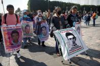 FILE PHOTO: People march towards the Basilica of Our Lady of Guadalupe to mark the disappearance of the 43 students of Ayotzinapa in Mexico City