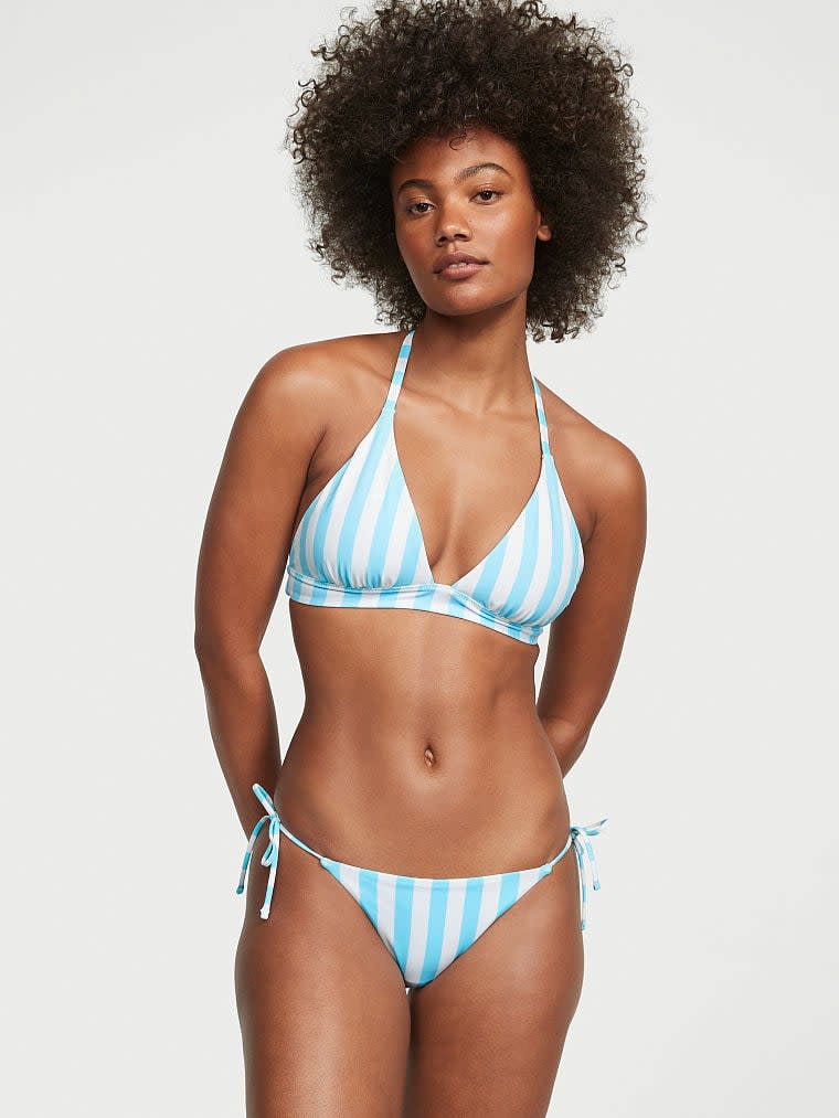 model wearing blue and white striped halter bikini