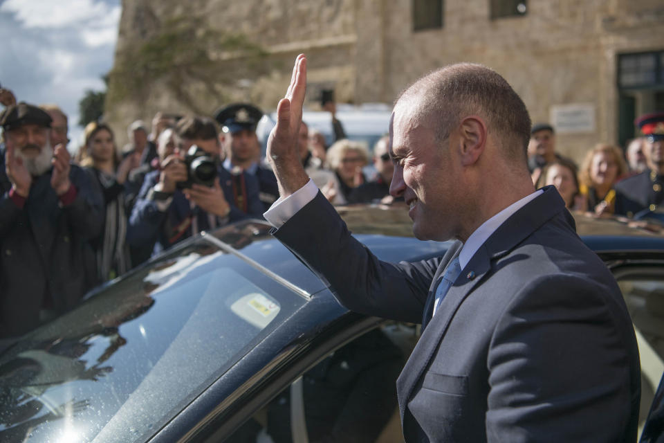 Joseph Muscat leaves his office of Castille for the last time, as he goes to the president with his resignation, in Valletta, Malta, Monday, Jan. 13, 2020. Robert Abela is replacing Muscat as premier after weeks of protests demanding accountability in the investigation of the car bomb slaying of an anti-corruption journalist who targeted his government. (AP Photo/Rene' Rossignaud)
