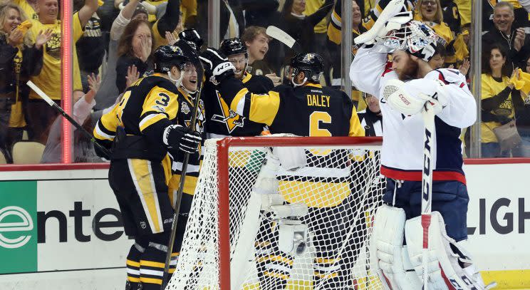 Washington Capitals goalie Braden Holtby (70) reacts as the Pittsburgh Penguins celebrate a goal by center Jake Guentzel (59) during the second period. (Charles LeClaire-USA TODAY Sports)