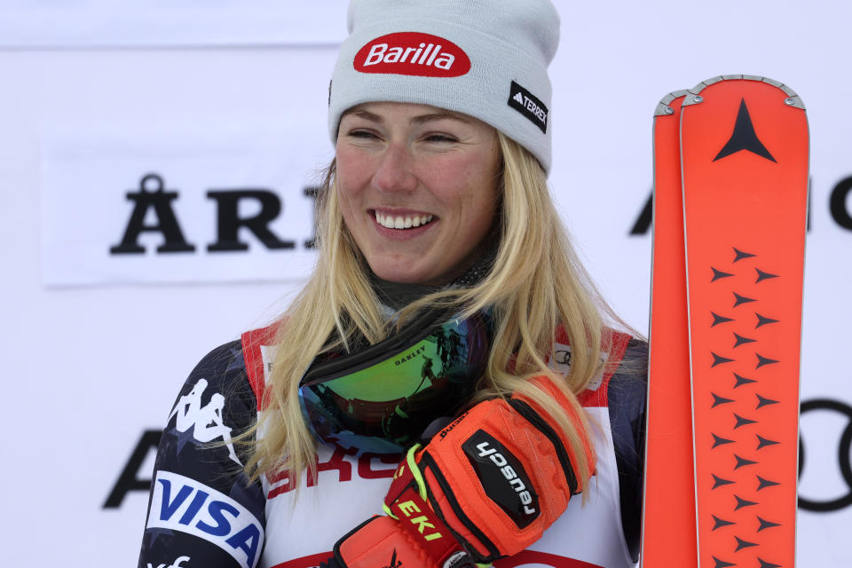 United States' Mikaela Shiffrin celebrates on the podium after winning an alpine ski, women's World Cup giant slalom race, in Are, Sweden, Friday, March 10, 2023. Shiffrin has won her record-tying 86th World Cup race with victory in a giant slalom, matched the overall record set by Swedish great Ingemar Stenmark 34 years ago. (AP Photo/Alessandro Trovati)