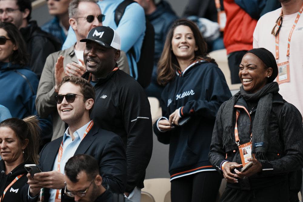 Corey, left with cap, and Candi Gauff, right, parents of Coco Gauff of the U.S., watch her fourth round match against Belgium’s Elise Mertens at the French Open tennis tournament in Roland Garros stadium in Paris, France, Sunday, May 29, 2022. (AP Photo/Thibault Camus)