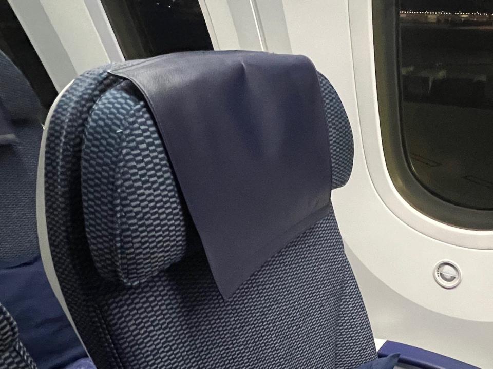 The seat's adjustable headrest.