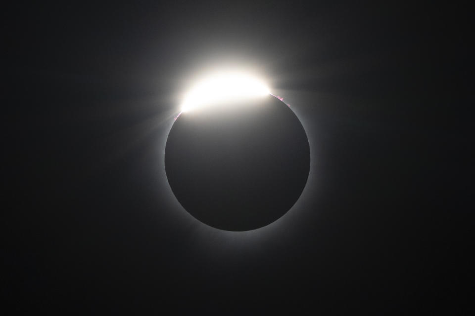 The moon nearly covers the sun during a total solar eclipse, as seen from Bishop's University in Sherbrooke, Quebec, Monday, April 8, 2024. (AP Photo/Mark Schiefelbein)