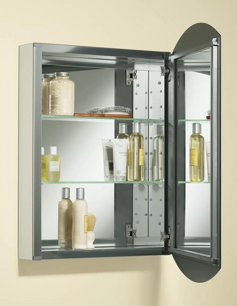 The interior of the cabinet with a mirrored surface and two shelves