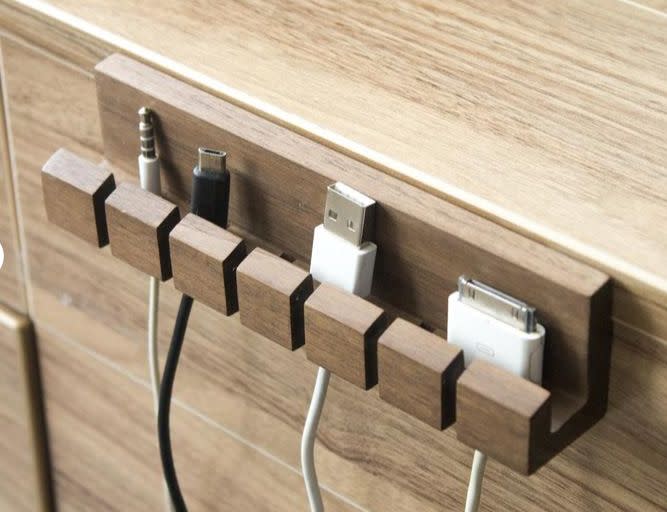 This wooden cable organizer keeps your cords close by and avoids tangling. Find it for $19 on <a href="https://fave.co/3gx1QUi" target="_blank" rel="noopener noreferrer">Etsy</a>.