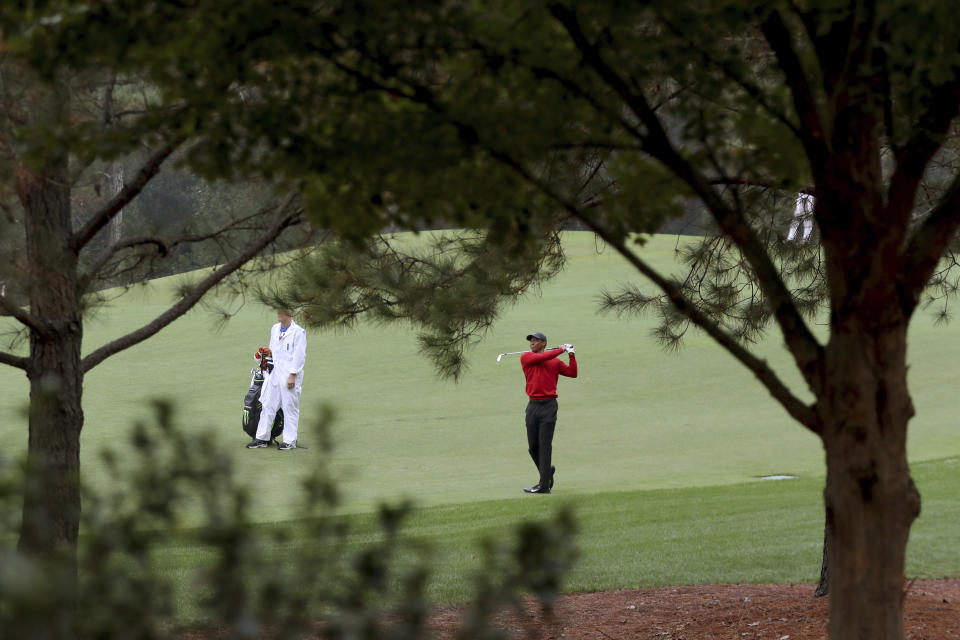 Tiger Woods hits his second shot on the second fairway during the final round of the Masters golf tournament Sunday, Nov. 15, 2020, in Augusta, Ga. (Curtis Compton/Atlanta Journal-Constitution via AP)