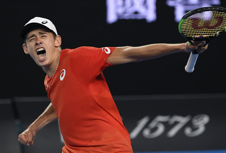 Australia's Alex de Minaur celebrates after defeating Switzerland's Henri Laaksonen in their second round match at the Australian Open tennis championships in Melbourne, Australia, Wednesday, Jan. 16, 2019. (AP Photo/Andy Brownbill)