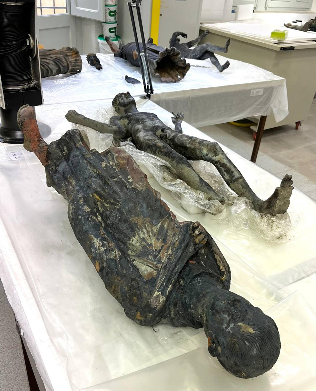 Finds, part of the discovery of two dozen well-preserved bronze statues from an ancient Tuscan thermal spring in San Casciano dei Bagni, central Italy, are seen in this undated photo made available by the Italian Culture Ministry, Thursday, Nov. 3, 2022. (Italian Culture Ministry via AP)