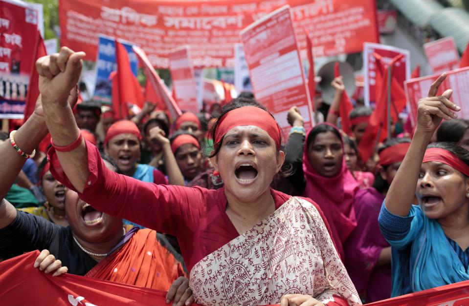 Bangladeshi garment workers and activists shout slogans demanding punishment for owners of garment factories that have had accidents in the past, compensation for victims and ensuring work place safety during a May Day rally in Dhaka, Bangladesh, Thursday, May 1, 2014. (AP Photo/A.M. Ahad)