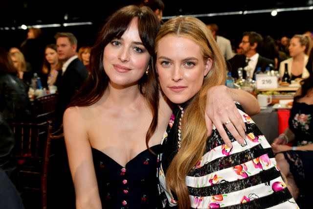 Amy Sussman/Getty Images Dakota Johnson and Riley Keough in Santa Monica, California, on Feb. 23, 2019