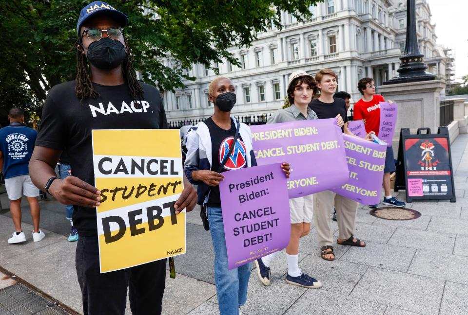 Student loan debt holders protest outside the White House staff entrance on July 27 in Washington, D.C.