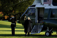 President Donald Trump salutes as he boards Marine One on the South Lawn of the White House, Wednesday, Oct. 21, 2020, in Washington. Trump is en route to North Carolina. (AP Photo/Alex Brandon)