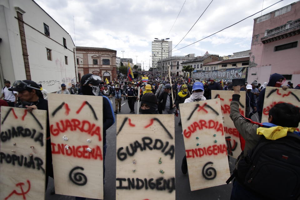 Indigenous anti-government demonstrators march against President Lenin Moreno and his economic policies during a nationwide strike, in Quito, Ecuador, Wednesday, Oct. 9, 2019. Ecuador's military has warned people who plan to participate in a national strike over fuel price hikes to avoid acts of violence. The military says it will enforce the law during the planned strike Wednesday, following days of unrest that led Moreno to move government operations from Quito to the port of Guayaquil. (AP Photo/Carlos Noriega)