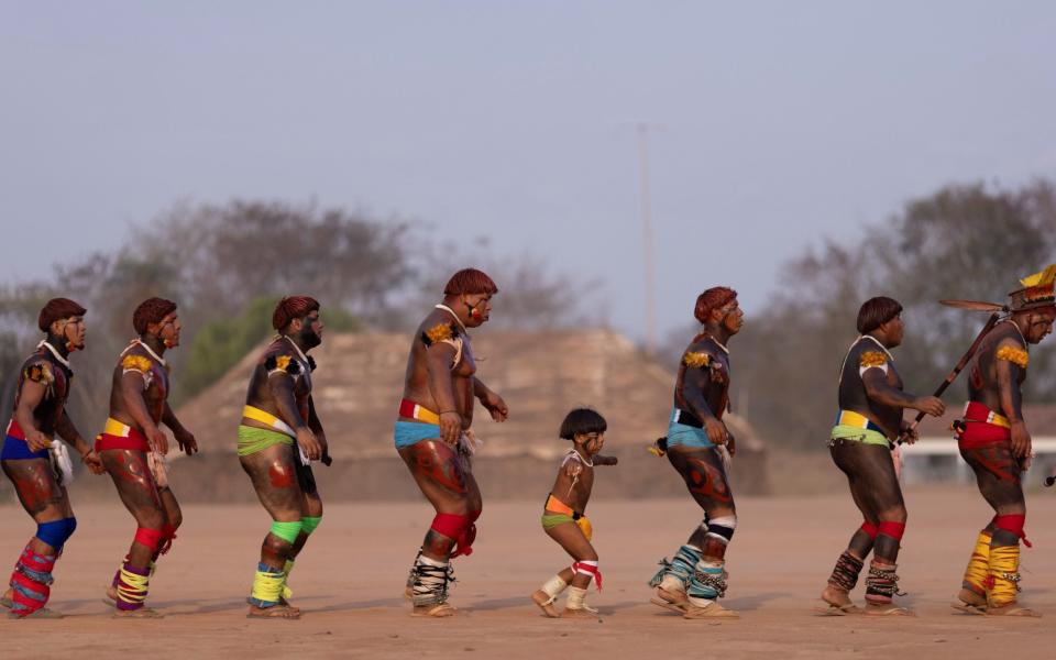 Besieged Amazon tribes grant rare access to Xingu chief’s funeral rites - UESLEI MARCELINO /REUTERS