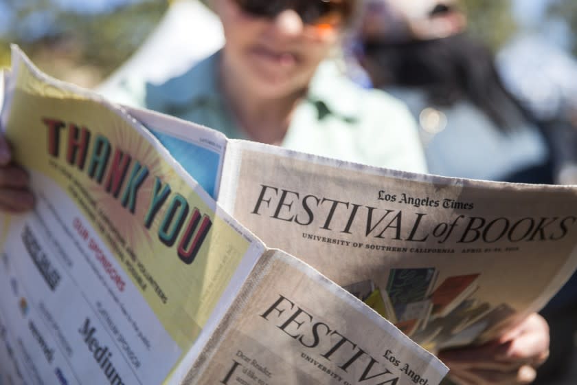 Linda Arkin, 75, of Valencia, looks over the Festival of Books section of the Los Angeles Times on Saturday, April 21, 2018.