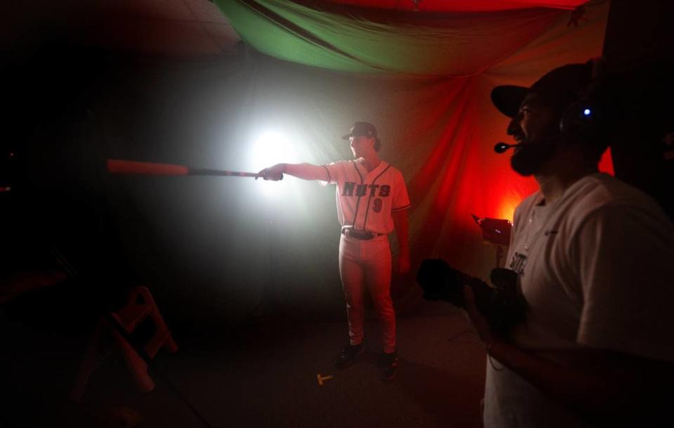 Modesto Nuts infielder Charlie Pagliarini works with videographer Ernesto Pulido during media day at John Thurman Field in Modesto, Calif., Tuesday, April 2, 2024.