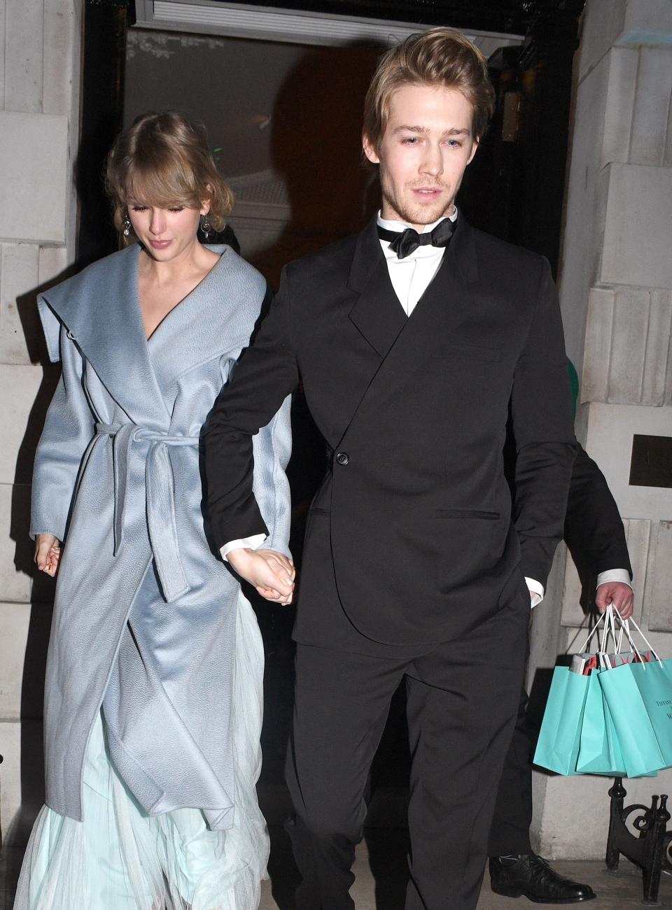 the couple leaving Tiffany's with in black tie attire and Tiffany bags