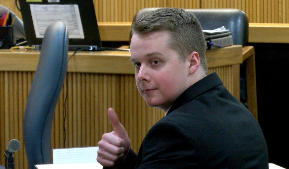 Liam McAtasney turns around to give his family members a thumbs up before the start of the afternoon session of his trial Thursday, January 24, 2019, in State Superior Court in Freehold.  He is charged with the murder of Sarah Stern.