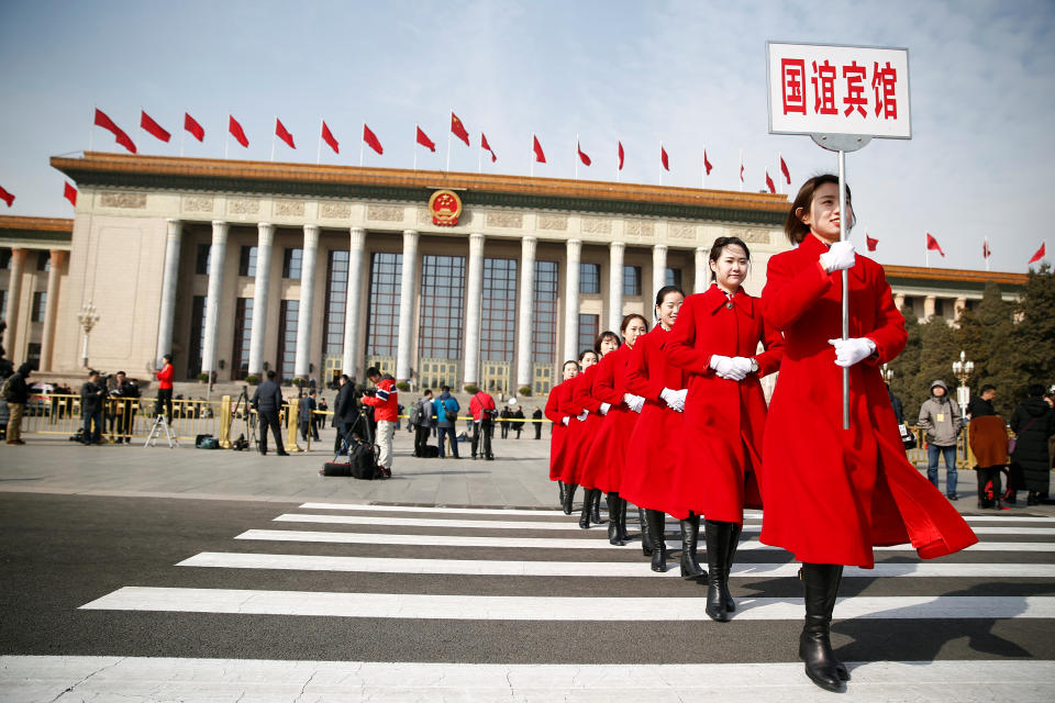 <p>Ushers walk outside the Great Hall of the People during the opening session of the National People’s Congress (NPC) in Beijing on March 5, 2018. (Photo: Thomas Peter/Reuters) </p>