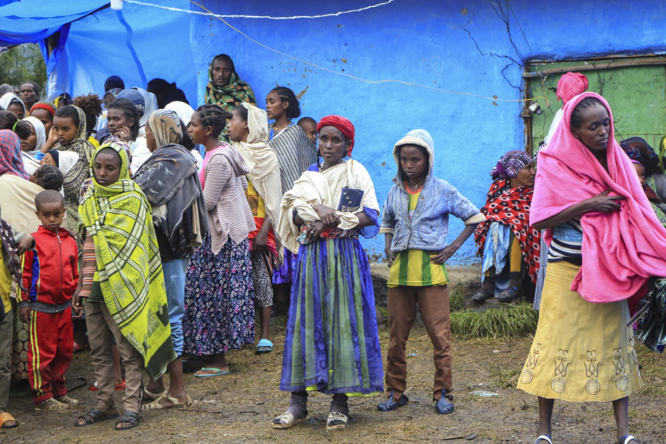 Displaced Amharas from different villages now controlled by Tigrayan forces in the North Gondar zone, gather in a kindergarten school housing the internally-displaced, in Debark, in the Amhara region of northern Ethiopia Wednesday, Aug. 25, 2021. As they bring war to other parts of Ethiopia such as the Amhara region, resurgent Tigray fighters face growing allegations that they are retaliating for the abuses their people suffered back home, sending hundreds of thousands of people fleeing in the past two months. (AP Photo)