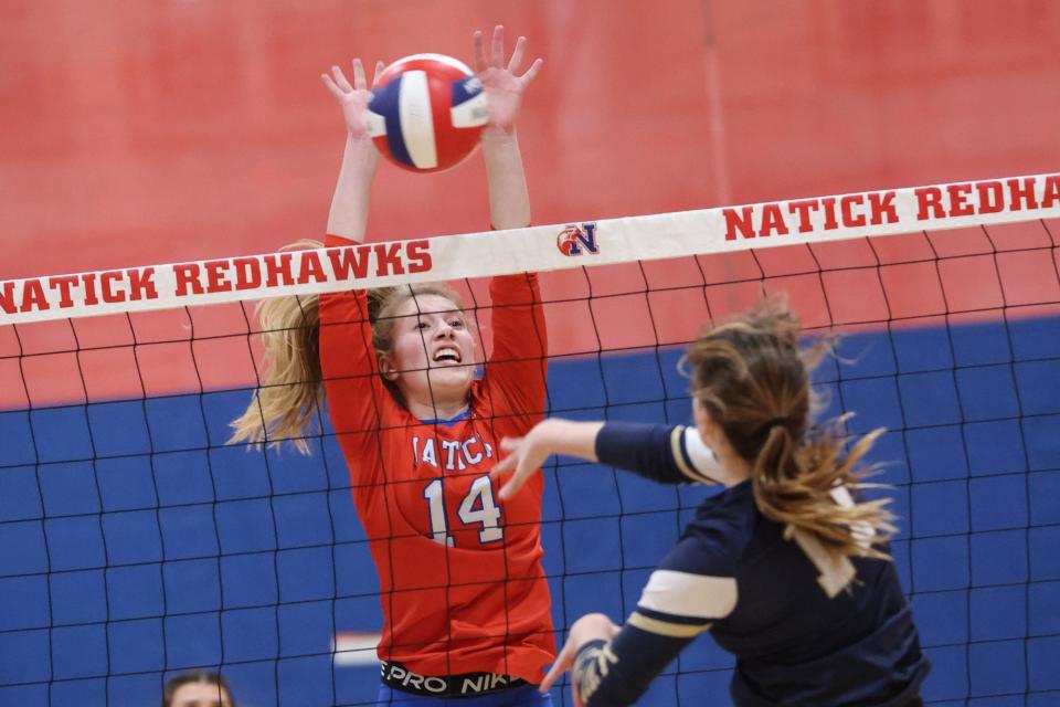 Natick’s Leah Austin goes up for the block during the during the first-round playoff match against Lexington at Natick High School Nov. 02, 2023.