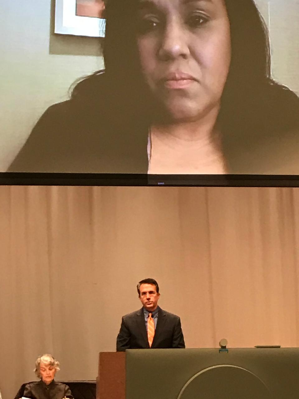 At a meeting at Snead State Community College Tuesday, National Compassion Fund Executive Director Jeffery Dion spoke to those in the auditorium as others participate via Zoom about the Albertville Survivors Fund for victims of the June 15 shootings at the Mueller plant.