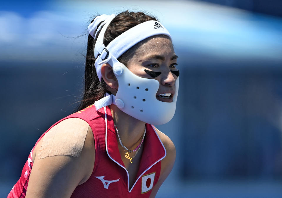 <p>Japan's Hazuki Nagai uses a protection as she plays during the women's pool B match of the Tokyo 2020 Olympic Games field hockey competition against China, at the Oi Hockey Stadium in Tokyo on July 25, 2021. (Photo by Ina Fassbender / AFP) (Photo by INA FASSBENDER/AFP via Getty Images)</p> 