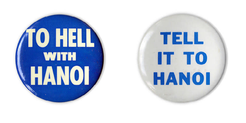 Two buttons read "To hell with Hanoi" in white text over blue background, and "Tell it to Hanoi" in blue text over a white background